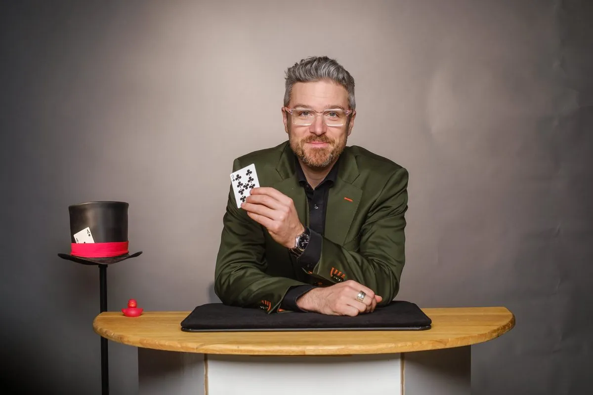 André Desery at the magic table