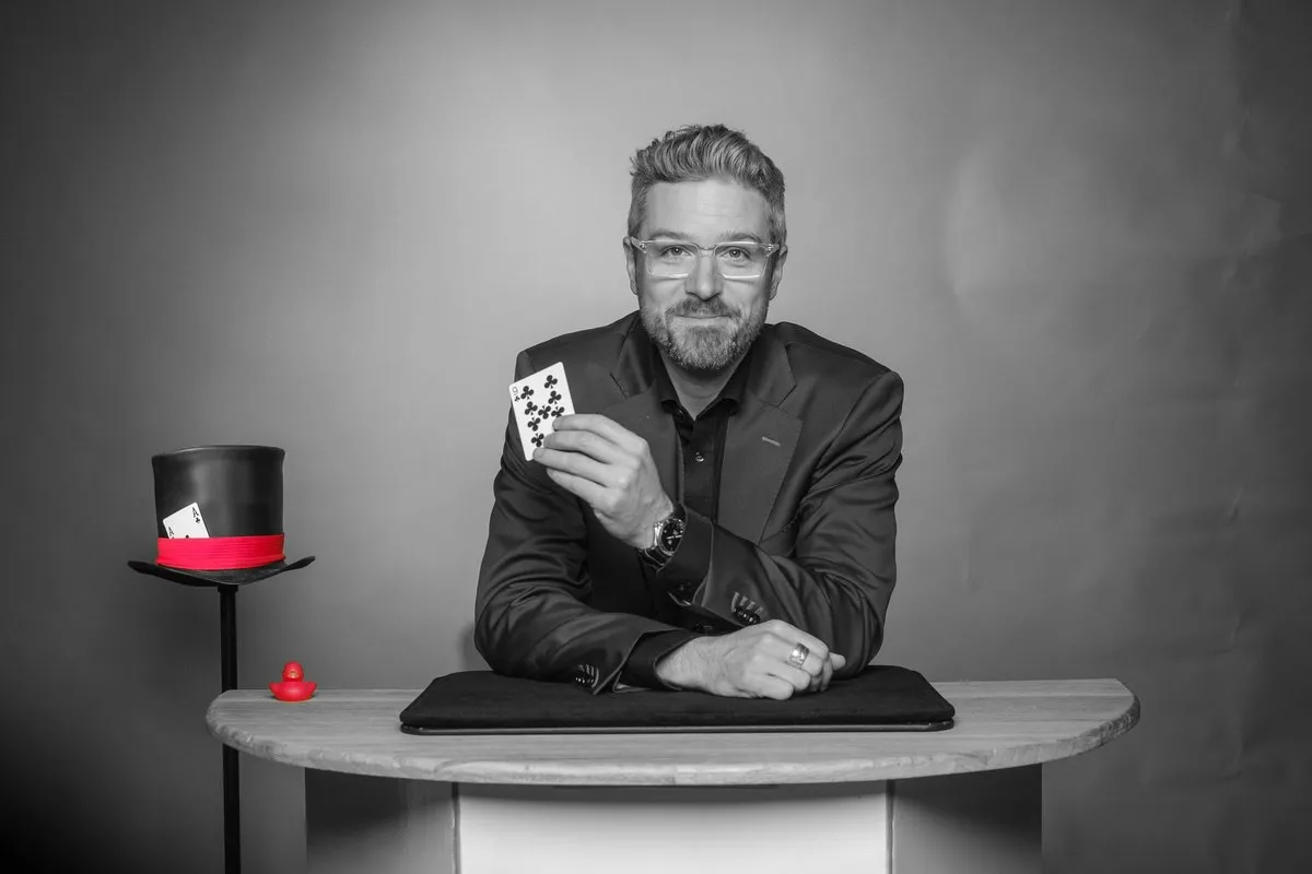 André Desery at the magic table