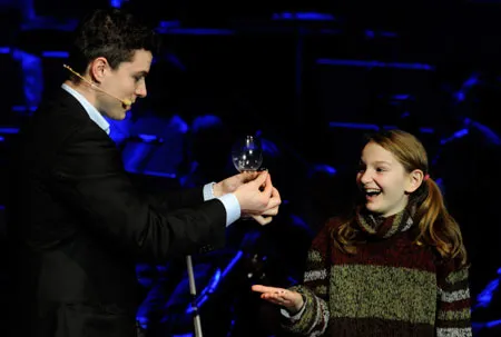 Magic show with a young volunteer