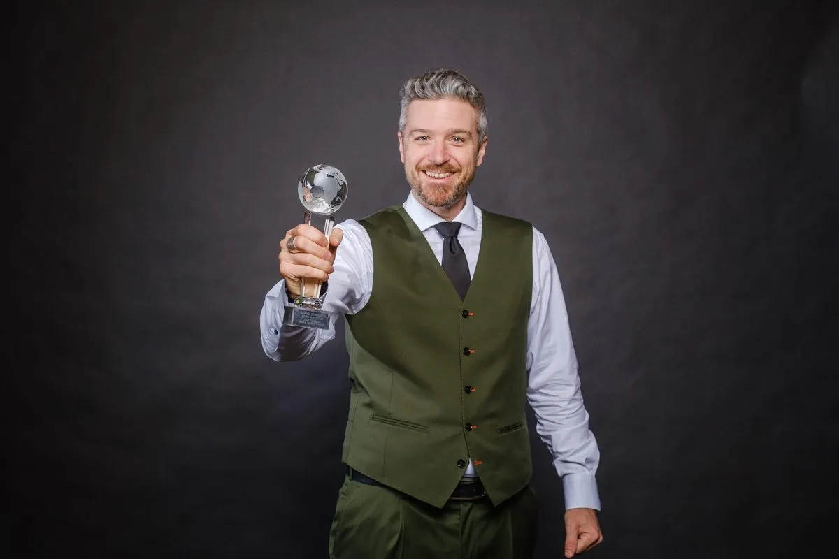 André Desery with the Grand Champion trophy
